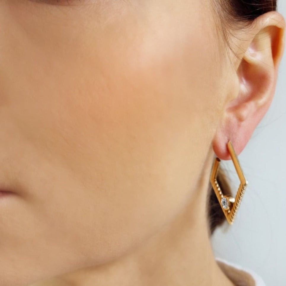 Legacy Collection Blige Earrings in 18ct yellow gold with 0.76ct VS/SI diamonds, 40mm length. Luxurious door-knocker design, a statement of sophistication and style. Customizable with alternative gemstones. Sold as a pair