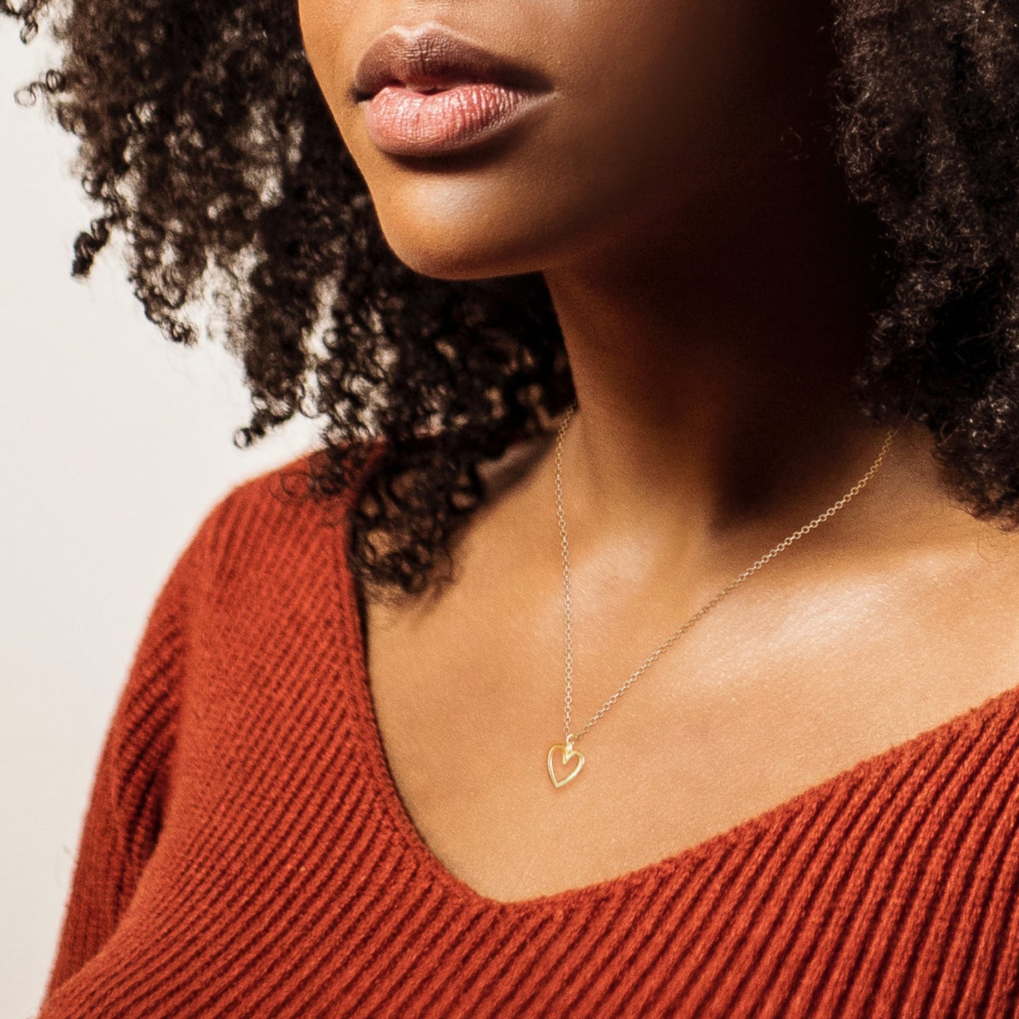 Adinkra Collection Akoma Necklace in polished 14ct yellow gold, 10mm pendant. Symbolising love, patience, and faithfulness. Perfect for everyday wear, alone or layered. Sold on a 16-inch chain.